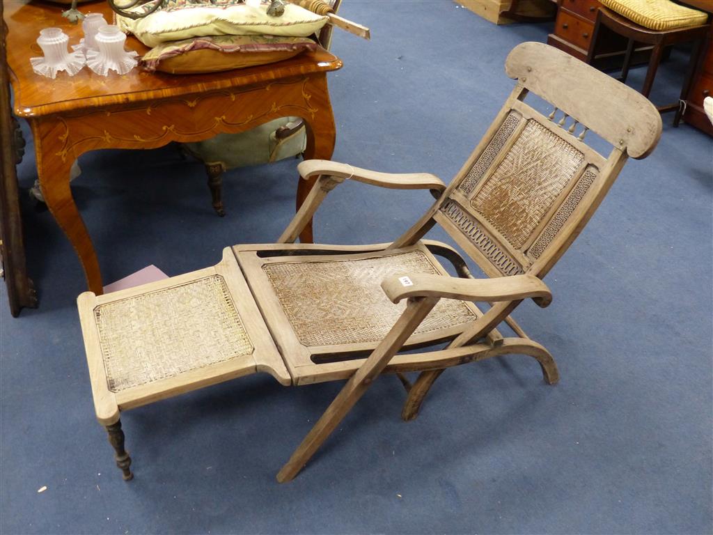 An Anglo Indian caned bleached hardwood steamer chair